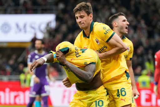 AC Milan's Rafael Leao, left, is congratulated after scoring his side's 2nd goal during a Serie A soccer match between AC Milan and Fiorentina in Milan, Italy, Sunday, Oct. 19, 2025. (AP Photo/Luca Bruno) AC Milan's Rafael Leao, left, is congratulated after scoring his side's 2nd goal during a Serie A soccer match between AC Milan and Fiorentina in Milan, Italy, Sunday, Oct. 19, 2025. (AP Photo/Luca Bruno)