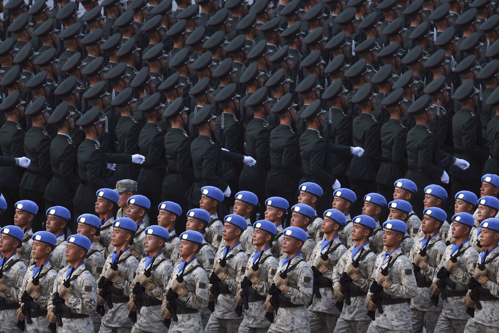 Military personnel take part in a military parade to commemorate the 80th anniversary of the end of World War II held in front of Tiananmen Gate in Beijing, China, Wednesday, Sept. 3, 2025. (Alexander Kazakov, Sputnik, Kremlin Pool Photo via AP)