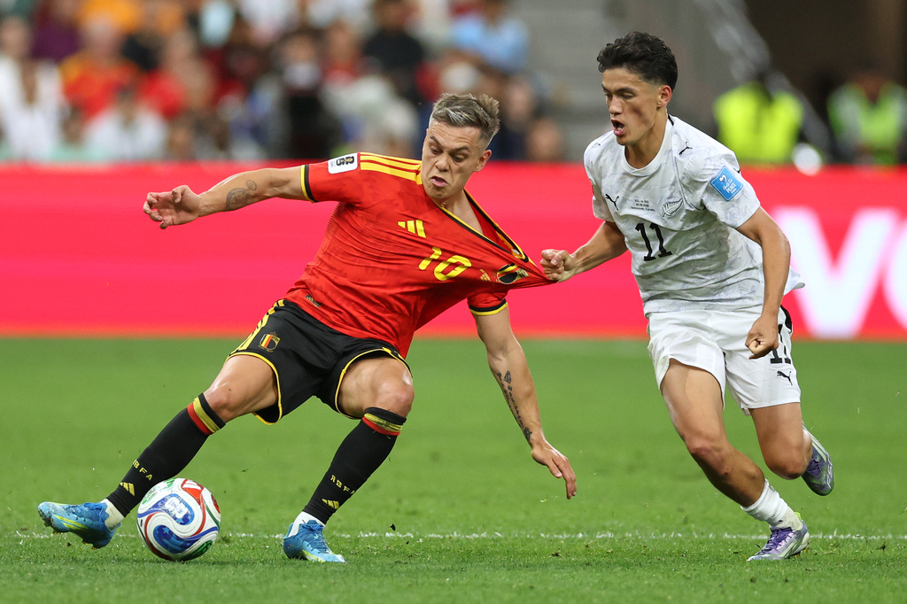 New Zealand's Elijah Just (11) pulls on the jersey of Belgium's Leandro Trossard (10) during the World Cup Group G soccer match between New Zealand and Belgium in Vancouver, British Columbia, Friday, June 26, 2026. (AP Photo/Kaleb Tatum)