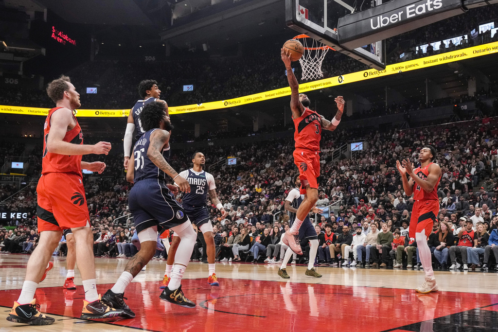 Toronto Raptors' Brandon Ingram (3) scores during first half NBA basketball action against the Dallas Mavericks, in Toronto on Sunday, March 8, 2026. (Chris Young/The Canadian Press via AP)