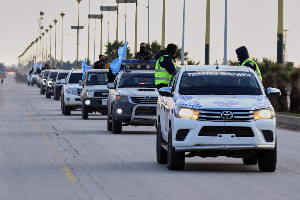 A convoy of Syria's Interior Ministry security forces arrives at Qamishli International Airport, eastern Syria, Sunday, Feb. 8, 2026, under an agreement with the Syrian Democratic Forces (SDF) aimed at stabilizing a ceasefire. (AP Photo/Baderkhan Ahmad)