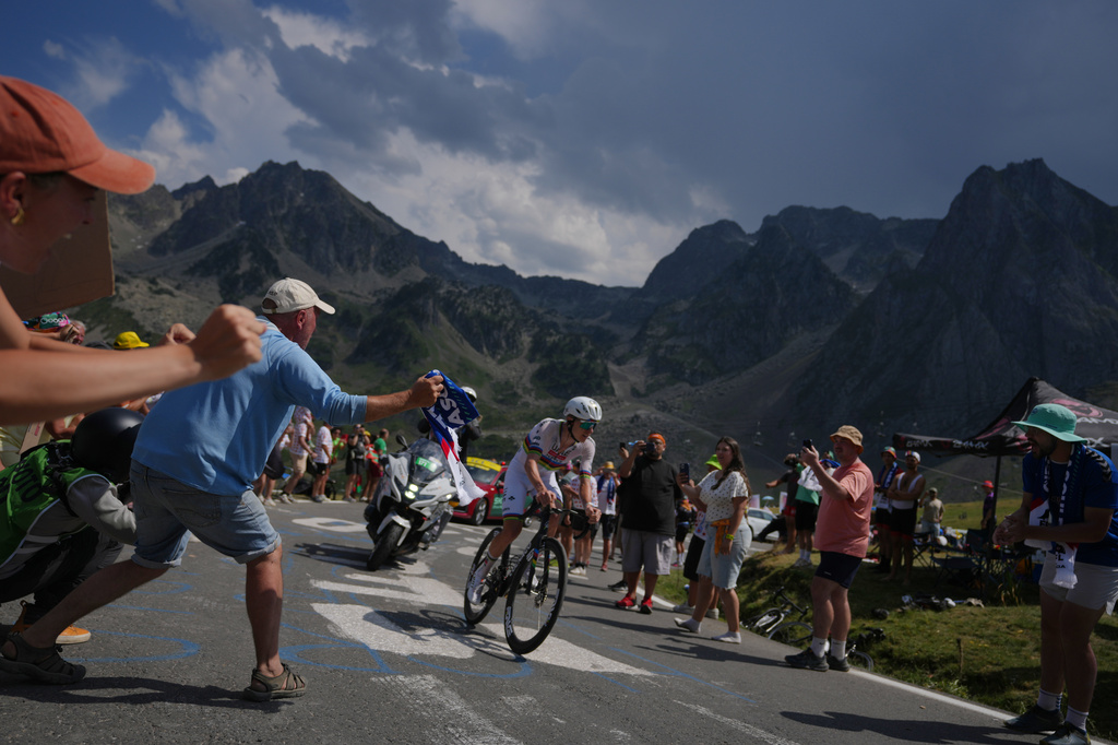Spectators cheer Slovenia's Tadej Pogacar during the sixth stage of the Tour de France cycling race with start in Pau and finish in Gavarnie-Gedre, France, Thursday, July 9, 2026. (AP Photo/Thibault Camus)