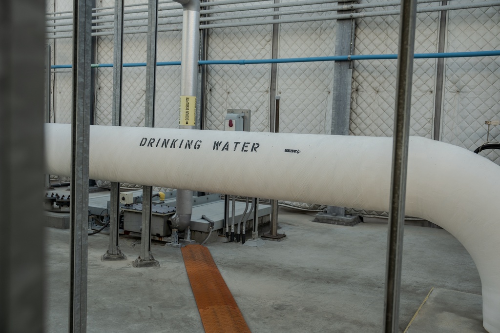 FILE - A pipe carrying drinking water runs through the Carlsbad desalination plant in Carlsbad, Calif., Dec. 2, 2025. (AP Photo/Annika Hammerschlag, File)