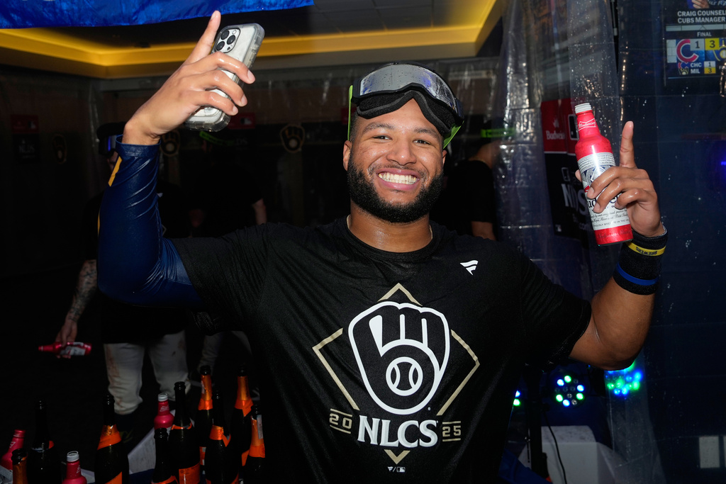 Milwaukee Brewers center fielder Jackson Chourio celebrates with teammates after the team's win over the Chicago Cubs in Game 5 of baseball's National League Division Series, Saturday, Oct. 11, 2025, in Milwaukee. (AP Photo/Kayla Wolf)