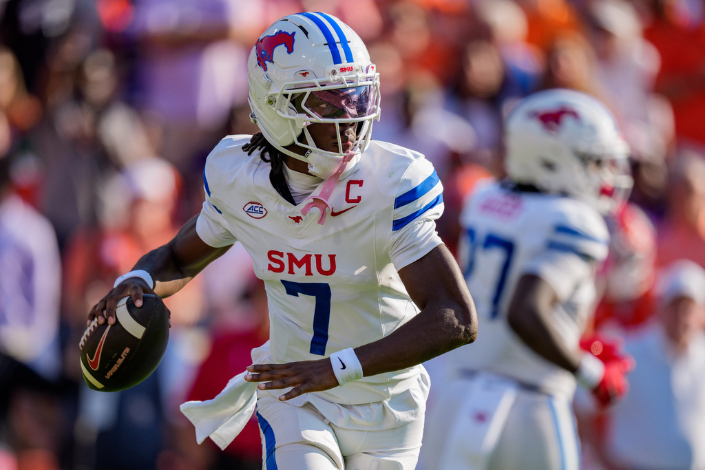 SMU quarterback Kevin Jennings (7) drops back to pass in the first half of an NCAA college football game against Clemson, Saturday, Oct. 18, 2025, in Clemson, S.C. (AP Photo/Jacob Kupferman)