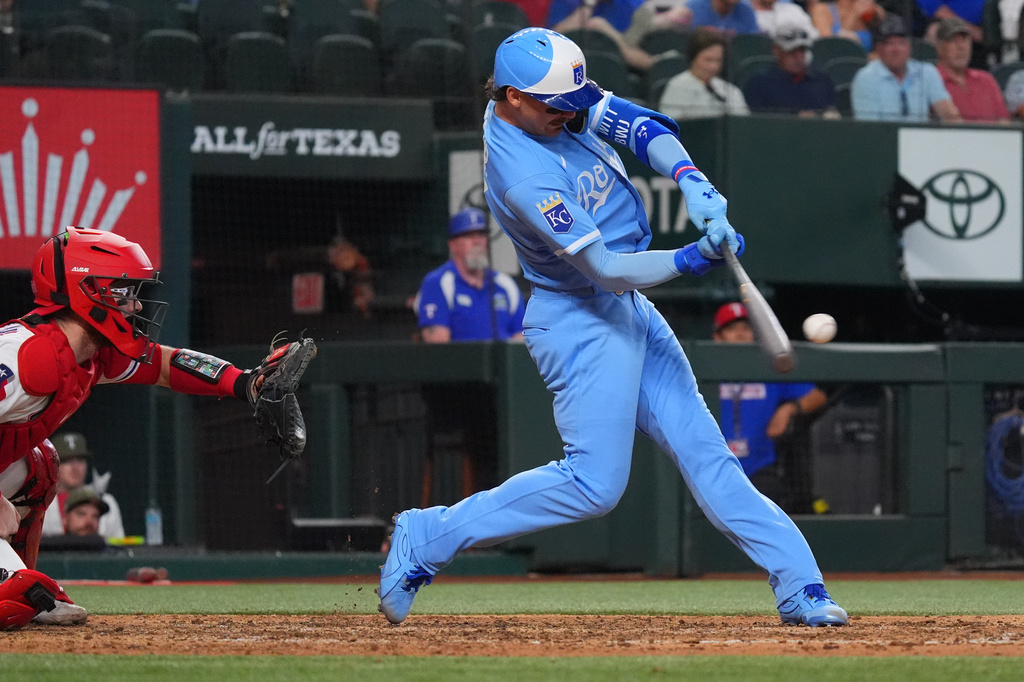 Kansas City Royals' Bobby Witt Jr. hits a single that scored teammate Nick Loftin during the seventh inning of a baseball game against the Texas Rangers, Saturday, May 30, 2026, in Arlington, Texas. (AP Photo/LM Otero)