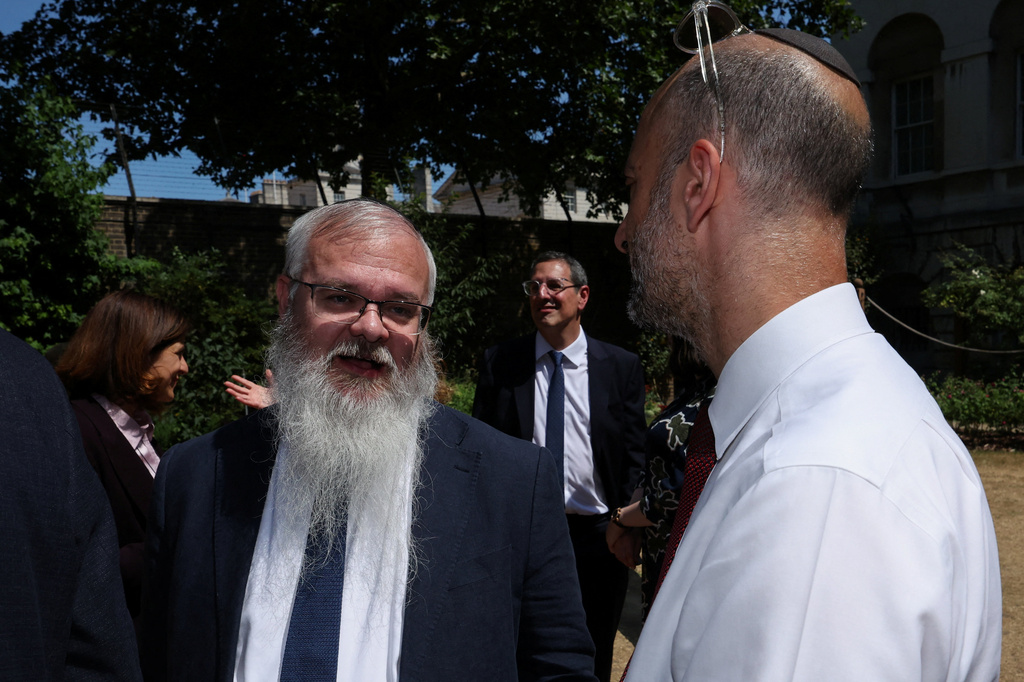 Rabbi Daniel Walker, left, leader of the Heaton Park Hebrew Congregation in Manchester, attends a meeting with Britain's Prime Minister Keir Starmer, who hosts a reception with the Jewish community, to discuss efforts to tackle antisemitism, at Downing Street in London, England, Monday, July 13, 2026. (Suzanne Plunkett/Pool Photo via AP)