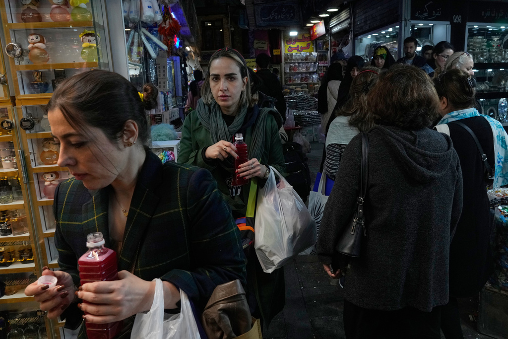 Women shop at the Tajrish Bazaar in northern Tehran, Iran, Thursday, Nov. 20, 2025. (AP Photo/Vahid Salemi)