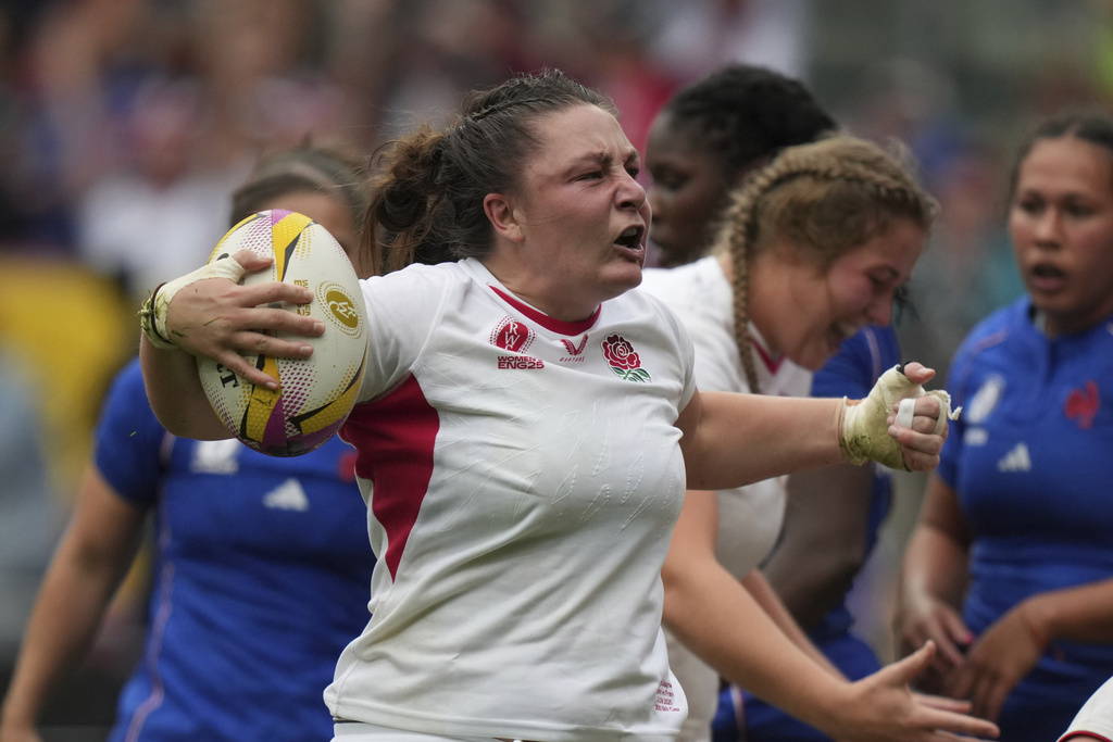 England's Amy Cokayne celebrates her try during the Women's Rugby World Cup 2025 semifinal match between France and England in Bristol, England, Saturday, Sept. 20, 2025.(AP Photo/Alastair Grant)