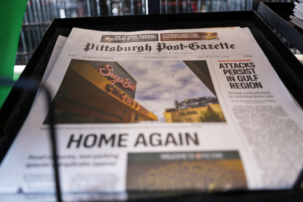 The printed edition of the Pittsburgh Post-Gazette sits in a newspaper rack, Thursday, April 2, 2026, in Pittsburgh. (AP Photo/Gene J. Puskar)