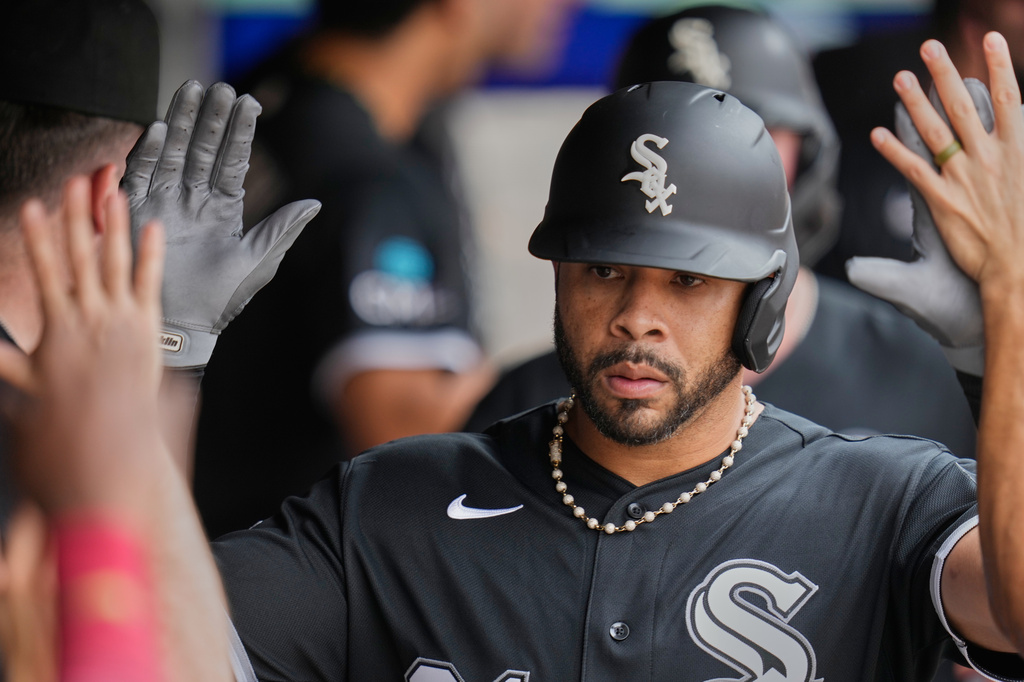 Chicago White Sox's Tommy Pham is congratulated in the dugout after hitting a three-run home run in the fifth inning of a baseball game against the Cleveland Guardians in Cleveland, Wednesday, Sept. 16, 2026. (AP Photo/Sue Ogrocki)