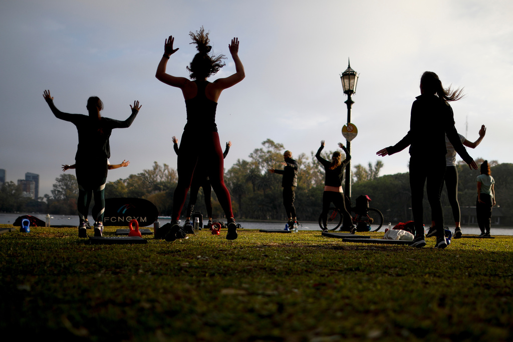 FILE - People exercise at a park in Buenos Aires, Argentina on June 2, 2021. (AP Photo/Natacha Pisarenko, File)