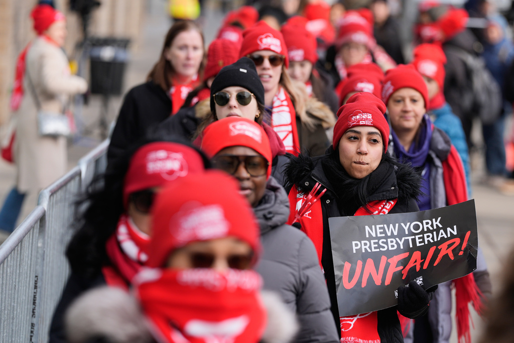 Striking nurses and supporters demonstrate outside NewYork-Presbyterian Hospital in New York, Thursday, Jan. 22, 2026. (AP Photo/Seth Wenig)