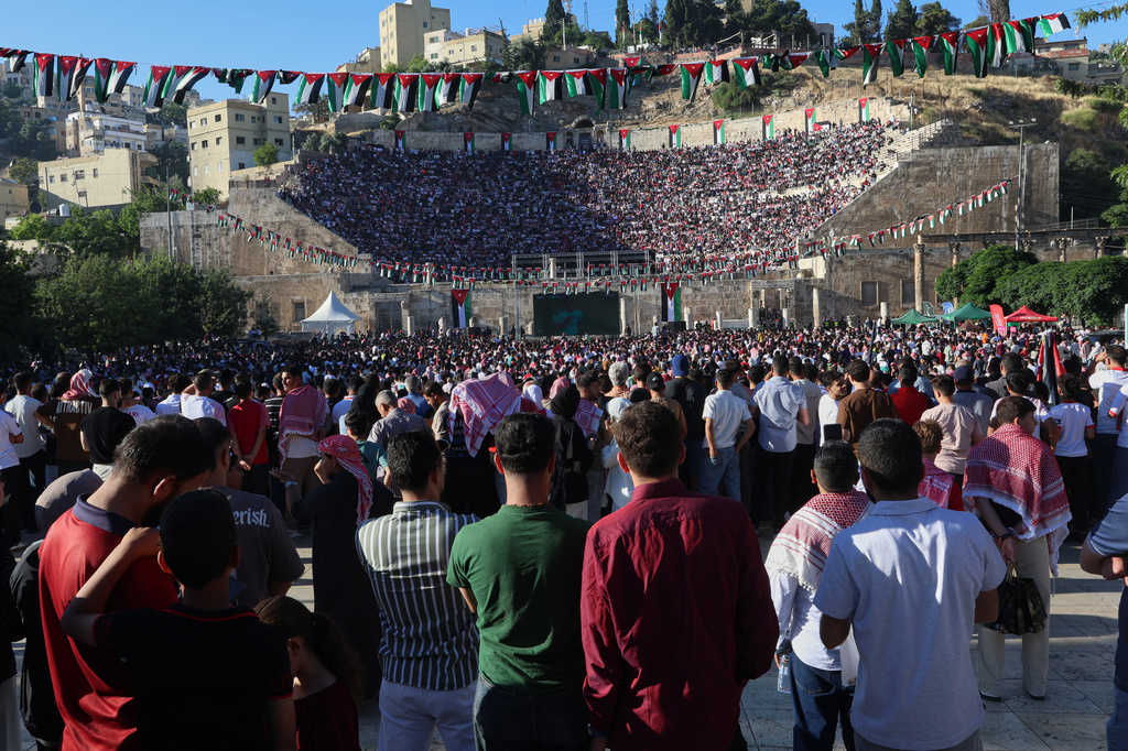 Jordanian soccer fans watch the World Cup match between Jordan and Austria on a large screen at the Roman Amphitheater in downtown Amman, Jordan, early Wednesday, June 17, 2026. (AP Photo/Raad Adayleh)