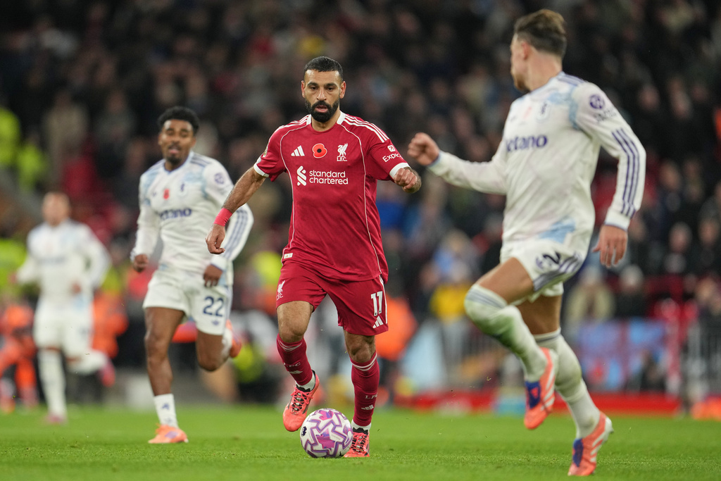 Liverpool's Mohamed Salah, centre, in action during the English Premier League soccer match between Liverpool and Aston Villa in Liverpool, England, Saturday, Nov. 1, 2025. (AP Photo/Jon Super)
