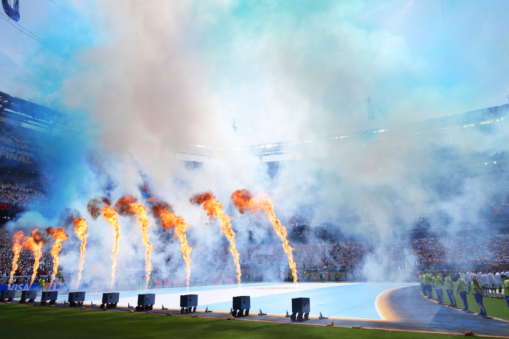 Pyrotechnics fire as players line up during the pregame ceremony before the World Cup championship final soccer match between Spain and Argentina in East Rutherford, N.J., Sunday, July 19, 2026. (AP Photo/Jacquelyn Martin)