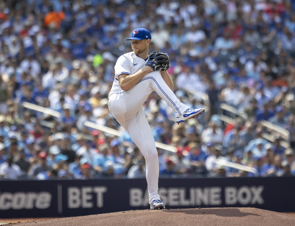 Toronto Blue Jays' Eric Lauer (56) pitches against the Texas Rangers during the first inning of a baseball game in Toronto, Saturday, Aug. 16, 2025. (Tara Walton/The Canadian Press via AP)
