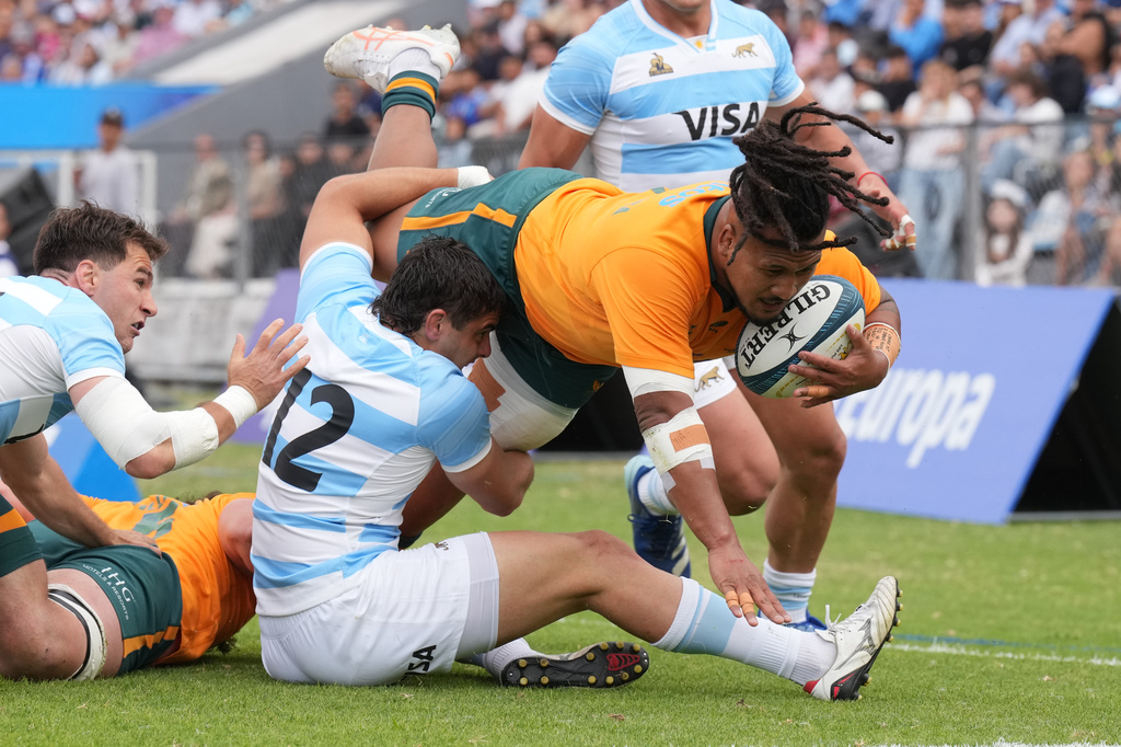 Australia Brandon Paenga-Amosa is tackled by Argentina Faustino Sanchez Valarolo during a rugby test match in Jujuy, Argentina, Saturday, Aug. 29, 2026. (AP Photo/Gustavo Garello)