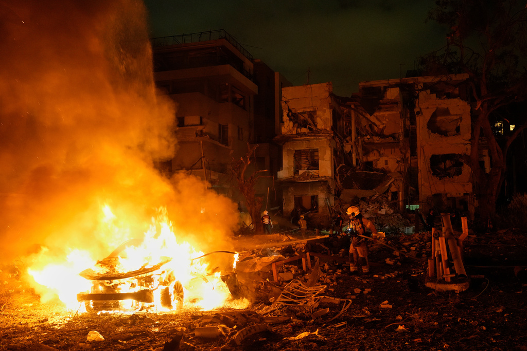 FILE - Firefighters work to extinguish a blaze after a missile launched from Iran struck Tel Aviv, Israel, Monday, June 16, 2025. (AP Photo/Baz Ratner, File)