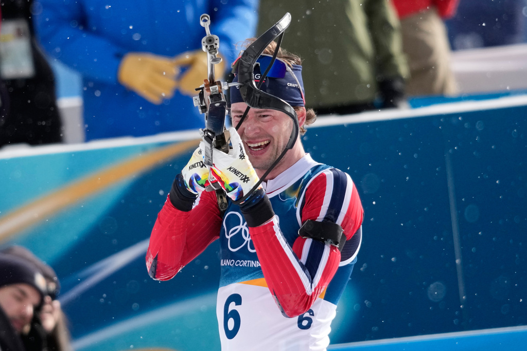 Norway's Sturla Holm Laegreid prepares to shoot during the men's biathlon 15-kilometers mass start race at the 2026 Winter Olympics, in Anterselva, Italy, Friday, Feb. 20, 2026. (AP Photo/David J. Phillip)