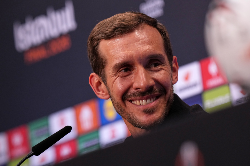 Freiburg's coach Julian Schuster smiles during a press conference ahead of the Europa League final soccer match between Freiburg and Aston Villa in Istanbul, Turkey, Tuesday, May 19, 2026. (AP Photo/Francisco Seco, Pool)