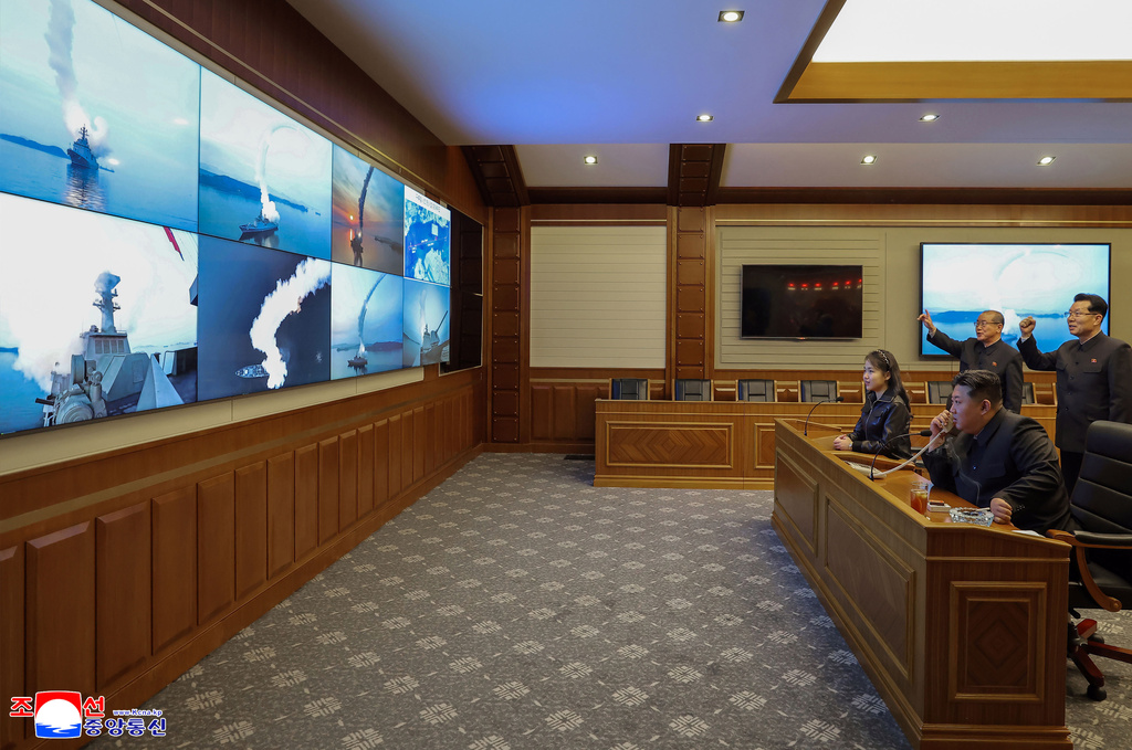 This photo provided by the North Korean government shows its leader Kim Jong Un, front right, and his daughter, second right at front, watch what it says the cruise missiles launches from the naval destroyer, the Choe Hyon, via video, in North Korea, Tuesday, March 10, 2026. Independent journalists were not given access to cover the event depicted in this image distributed by the North Korean government. The content of this image is as provided and cannot be independently verified. Korean language watermark on image as provided by source reads: "KCNA" which is the abbreviation for Korean Central News Agency. (Korean Central News Agency/Korea News Service via AP)