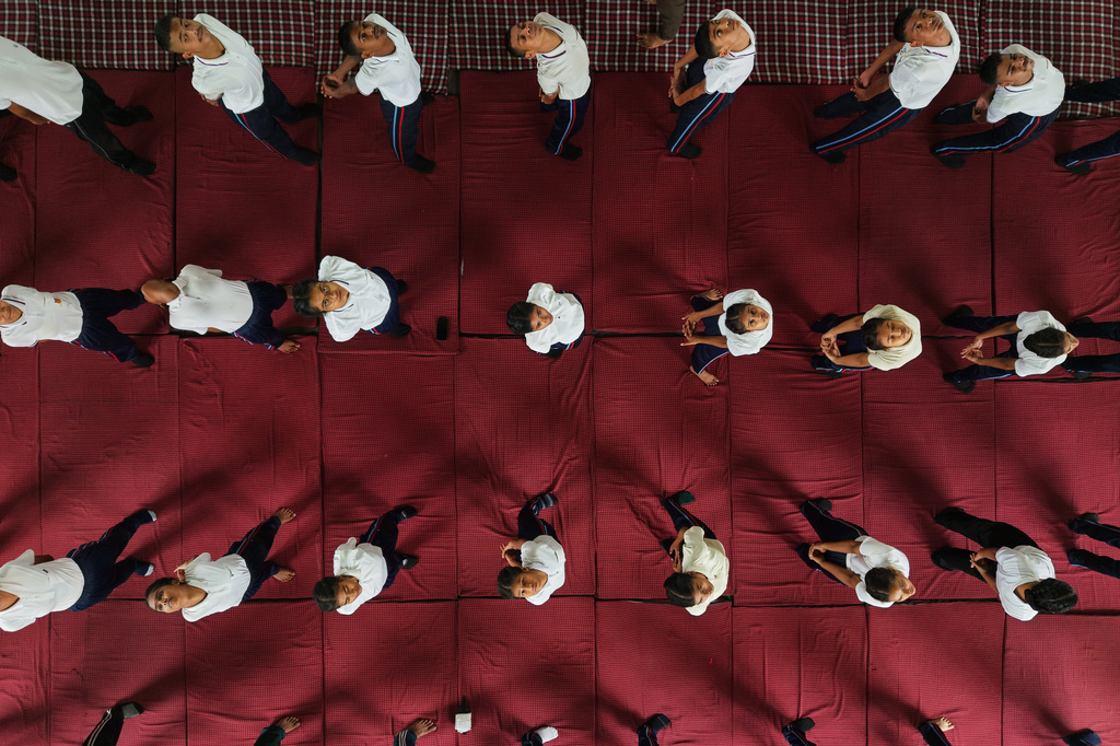 Students perform yoga during an event to mark International Yoga Day in Guwahati, India, Sunday, June 21, 2026. (AP Photo/Anupam Nath)