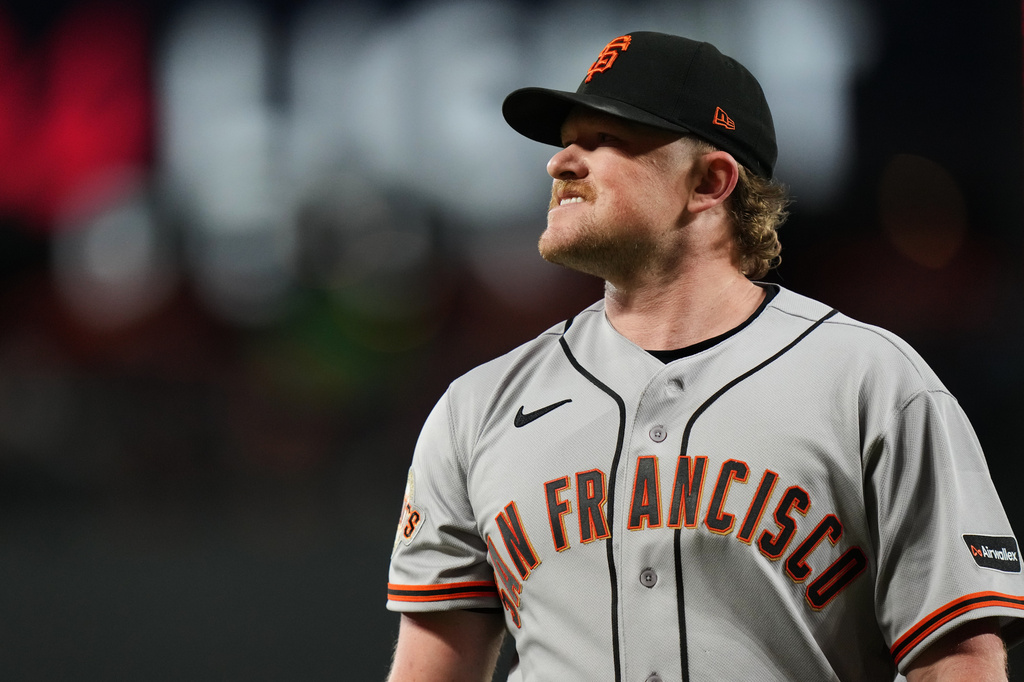 San Francisco Giants starting pitcher Logan Webb reacts while returning to the dugout after the second inning of a baseball game against the Baltimore Orioles, Saturday, April 11, 2026, in Baltimore. (AP Photo/Stephanie Scarbrough)