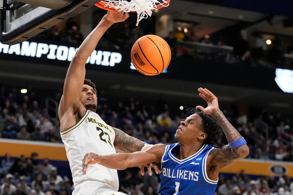 Michigan forward Yaxel Lendeborg (23) dunks over Saint Louis guard Quentin Jones (1) during the second half in the second round of the NCAA college basketball tournament, Saturday, March 21, 2026, in Buffalo, N.Y. (AP Photo/Yuki Iwamura)