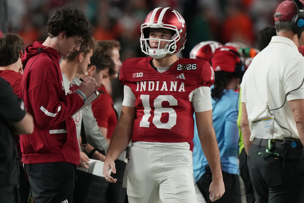 Indiana quarterback Alberto Mendoza (16) walks the sidelines during the College Football Playoff national championship game against Miami, Tuesday, Jan. 20, 2026, in Miami Gardens, Fla. (AP Photo/Marta Lavandier)