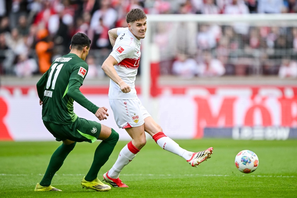 Wolfsburg's Adam Daghim, left, in action against Stuttgart's Adam Daghim during the German Bundesliga soccer match between VfB Stuttgart and VfL Wolfsburg in Stuttgart, Germany, Sunday, March 1, 2026. (Harry Langer/dpa via AP)