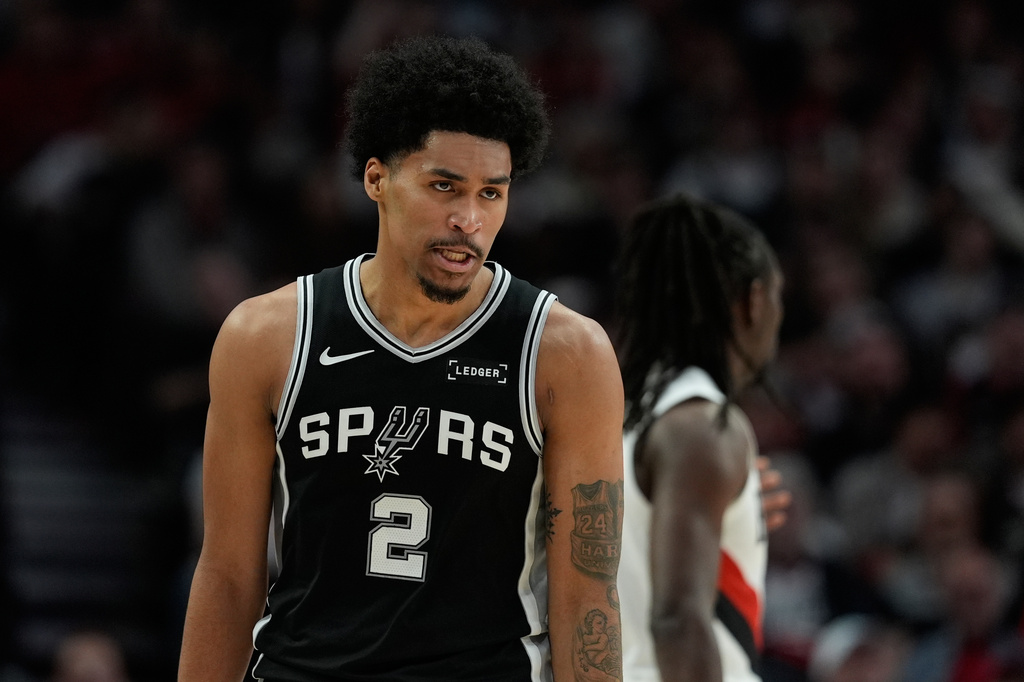 San Antonio Spurs guard Dylan Harper (2) reacts to a play during the second half in Game 3 of a first-round NBA playoffs basketball series against the Portland Trail Blazers in Portland, Ore, Friday, April 24, 2026. (AP Photo/Jenny Kane)