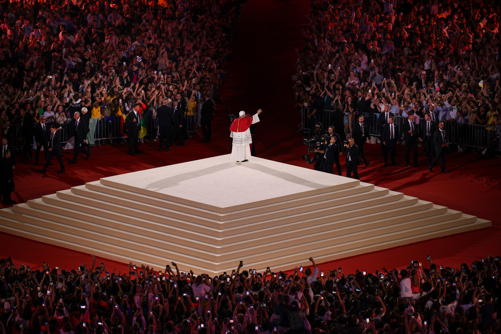 Pope Leo XIV waves after a prayer vigil with young people at the Stade de France in Saint-Denis near Paris, Friday, Sept. 25, 2026. (AP Photo/Thomas Padilla)