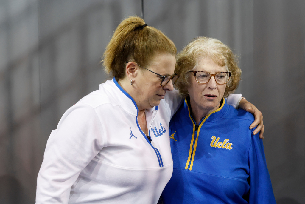 UCLA head coach Cori Close, left, embraces her mother, Patti Close, after speaking with the media after an NCAA college basketball game against Rutgers, Wednesday, Feb. 4, 2026, in Los Angeles. (AP Photo/Caroline Brehman)