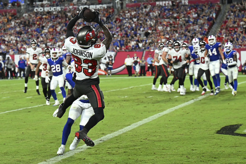 Tampa Bay Buccaneers wide receiver Tez Johnson scores against the Buffalo Bills during the first half of an NFL preseason football game, Saturday, Aug. 23, 2025, in Tampa, Fla. (AP Photo/Jason Behnken)