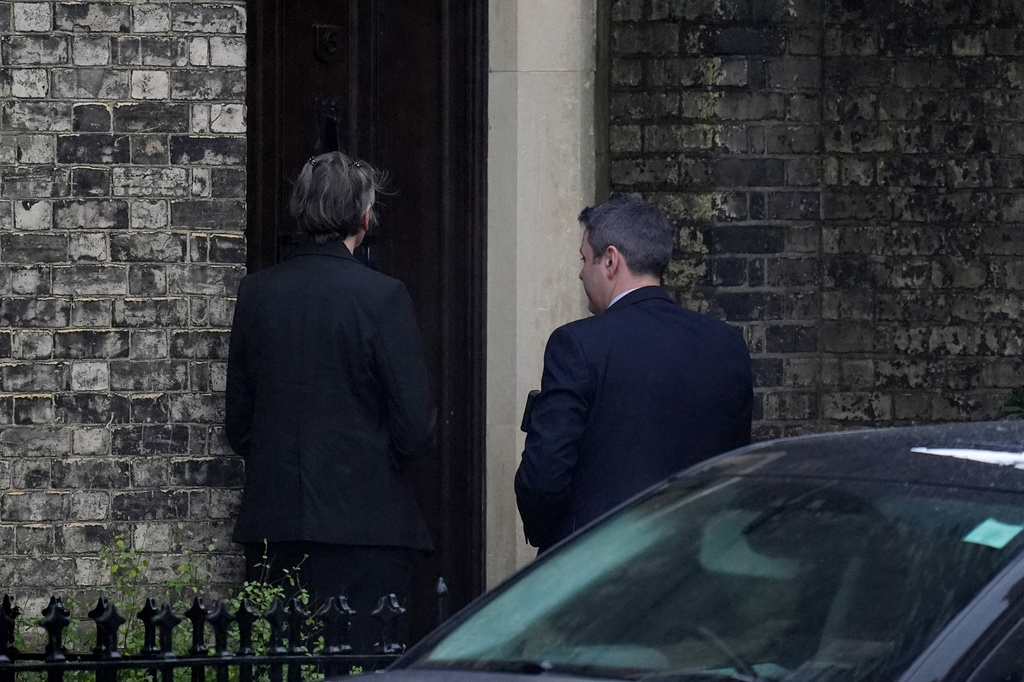 Two people wait to enter the home of Lord Peter Mandelson in north west London, Friday, Feb. 6, 2026. (Maja Smiejkowska/PA via AP)