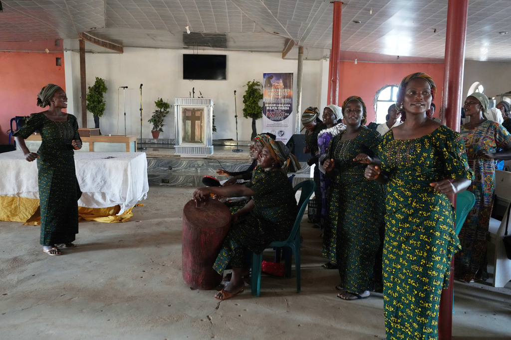 Christian women sing and dance during a midweek church service in Kaduna, northwestern, Nigeria, Nov. 5, 2025. (AP Photo/Sunday Alamba)