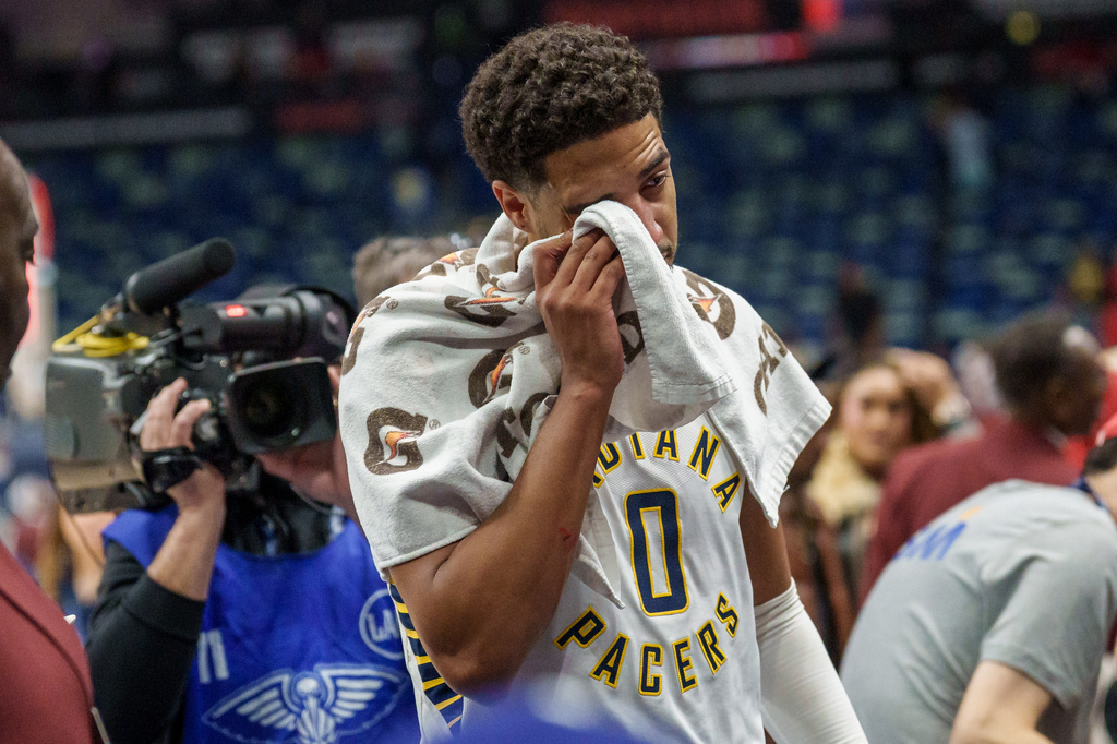 Indiana Pacers guard Tyrese Haliburton (0) wipes his eye at the end of an NBA basketball game against the New Orleans Pelicans in New Orleans, Wednesday, Oct. 21, 2026. (AP Photo/Matthew Hinton)