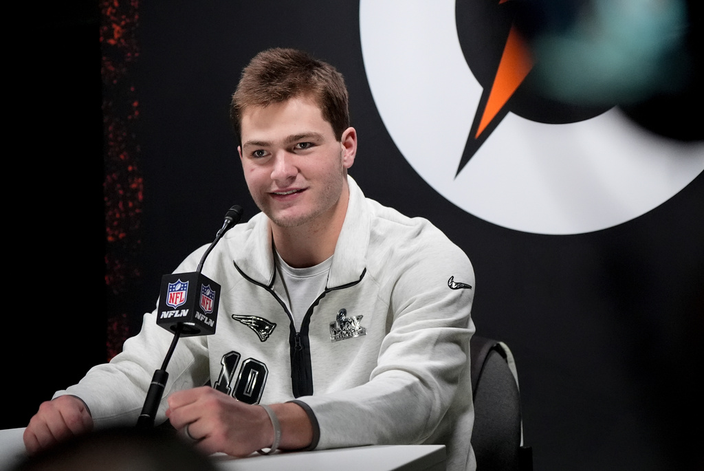 New England Patriots quarterback Drake Maye laughs during the NFL Super Bowl Opening Night, Monday, Feb. 2, 2026, in San Jose, Calif. ahead of the Super Bowl 60 football game between the New England Patriots and the Seattle Seahawks. (AP Photo/Brynn Anderson)
