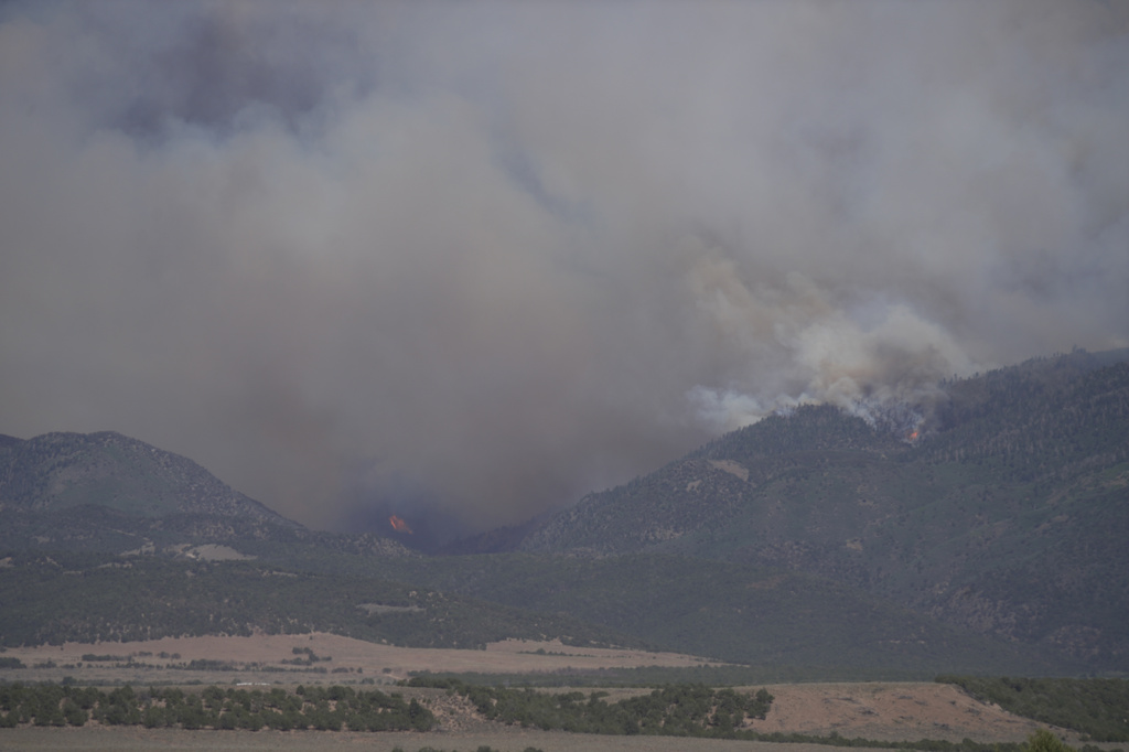 Smoke rises from the Cottonwood Fire near Beaver, Utah, on Friday, June 26, 2026. (AP Photo/Ty ONeil)
