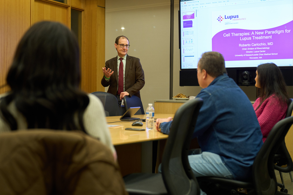 Dr. Roberto Caricchio, center, director of the Lupus Center at UMass Chan Medical School, speaks to a lupus support group, Feb. 12, 2025, in Worcester, Mass. (AP Photo/David Goldman)