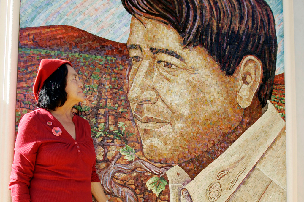FILE - United Farm Workers co-founder Dolores Huerta looks at a mural of the late Cesar Chavez during a dedication of the Cesar Chavez Monument on the San Jose State University campus in San Jose, Calif., Thursday, Sept. 4, 2008. (AP Photo/Paul Sakuma, File)