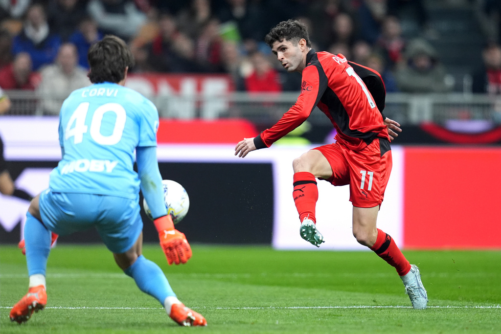AC Milan's Christian Pulisic, right, in action during the Italian Serie A soccer match between AC Milan and Parma in Milan, Italy, Sunday, Feb. 22 , 2025. (Spada/LaPresse via AP)