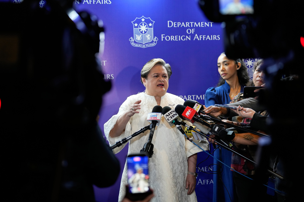 Philippine Foreign Secretary Maria Theresa Lazaro answers questions from reporters as they mark the 10th anniversary of a 2016 arbitration ruling which invalidated China's expansive claims in the disputed South China Sea during a conference in Manila, Philippines on Friday, July 10, 2026. (AP Photo/Aaron Favila)