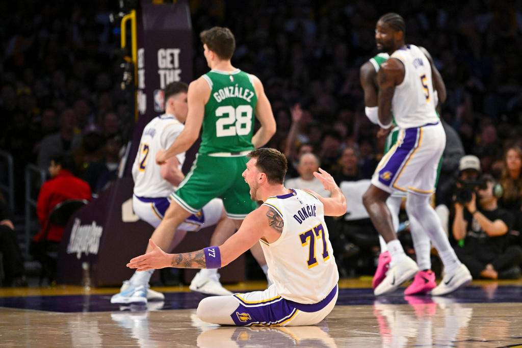 Los Angeles Lakers guard Luka Doncic reacts on the court during the first half of an NBA basketball game against the Boston Celtics Sunday, Feb. 22, 2026, in Los Angeles. (AP Photo/Katie Chin)