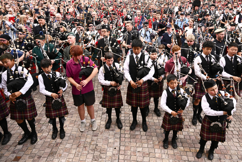 Bagpipers gather to break a world record for the largest ever bagpipe ensemble playing "It's a Long Way to the Top" by Australian rock band AC/DC in Melbourne, Australia, Wednesday, Nov. 12, 2025. (Joel Carrett/AAP Image via AP)