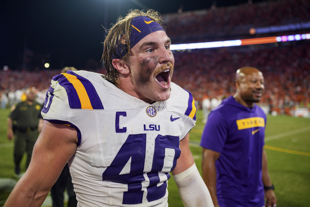 LSU linebacker Whit Weeks (40) reacts after defeating Clemson in an NCAA college football game Saturday, Aug. 30, 2025, in Clemson, S.C. (AP Photo/Jacob Kupferman)
