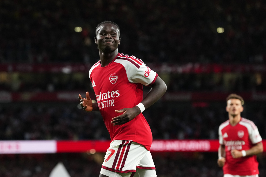 Arsenal's Bukayo Saka celebrates after scoring his side's second goal during the English Premier League soccer match between Arsenal and Coventry City in London, Friday, Aug. 21, 2026. (AP Photo/Kirsty Wigglesworth)