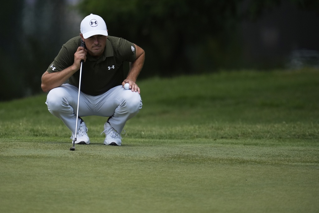 Jordan Spieth eyes a putt on the fourth green during the second round of the St. Jude Championship golf tournament Friday, Aug. 8, 2025, in Memphis, Tenn. (AP Photo/George Walker IV)