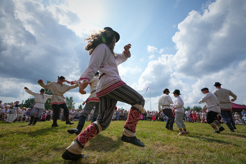 Estonia Seto Kingdom Day Men wearing traditional Seto costumes dance during the annual Seto Kingdom Day in Mikitamäe, south Estonia, Saturday, Aug. 1, 2026. (AP Photo/Sergei Grits)